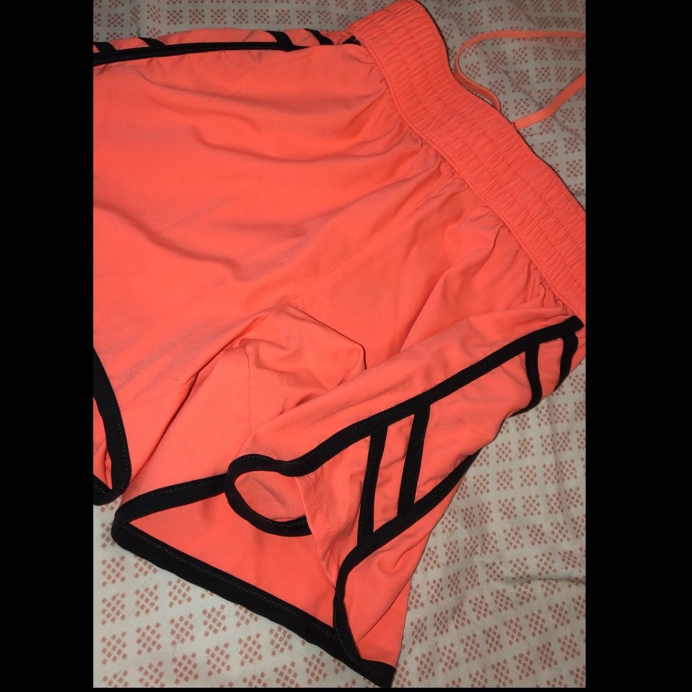 bright coral colored shorts